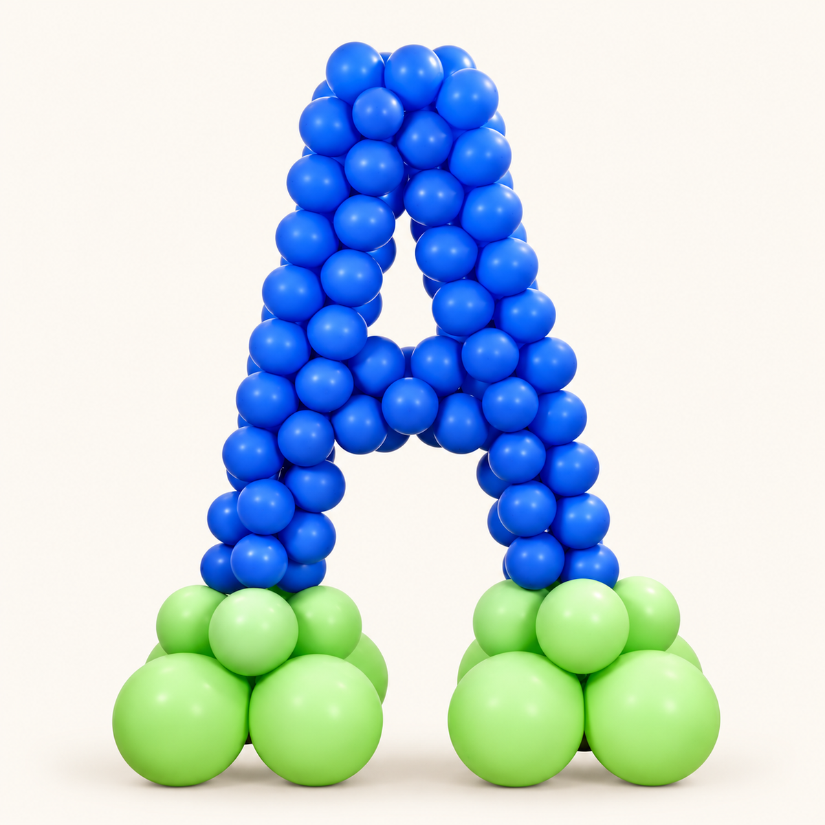 Giant letter A made from royal-blue balloons with light-green balloon clusters at each foot.