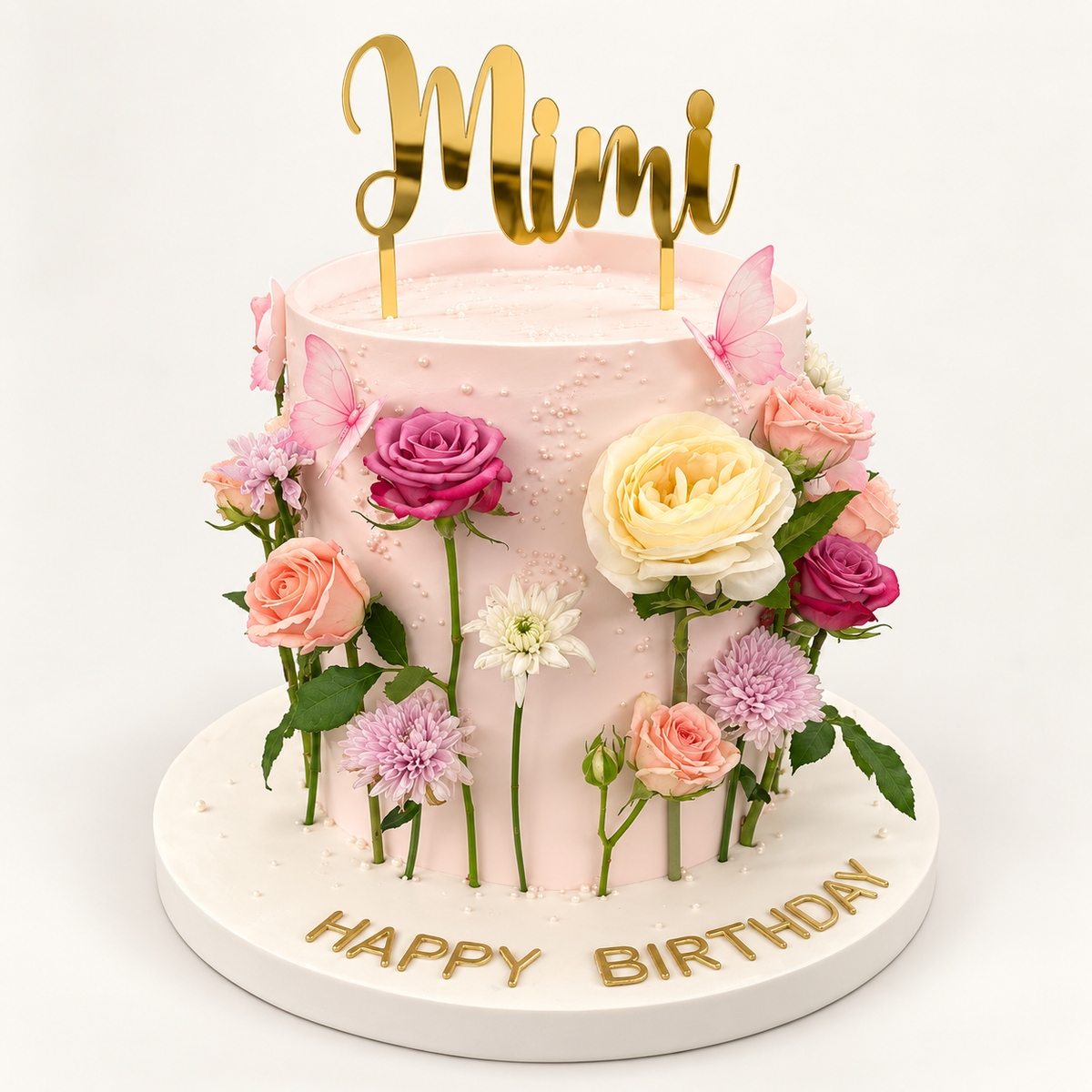 Blush Garden Celebration Cake with pastel flowers and butterflies, angled view
