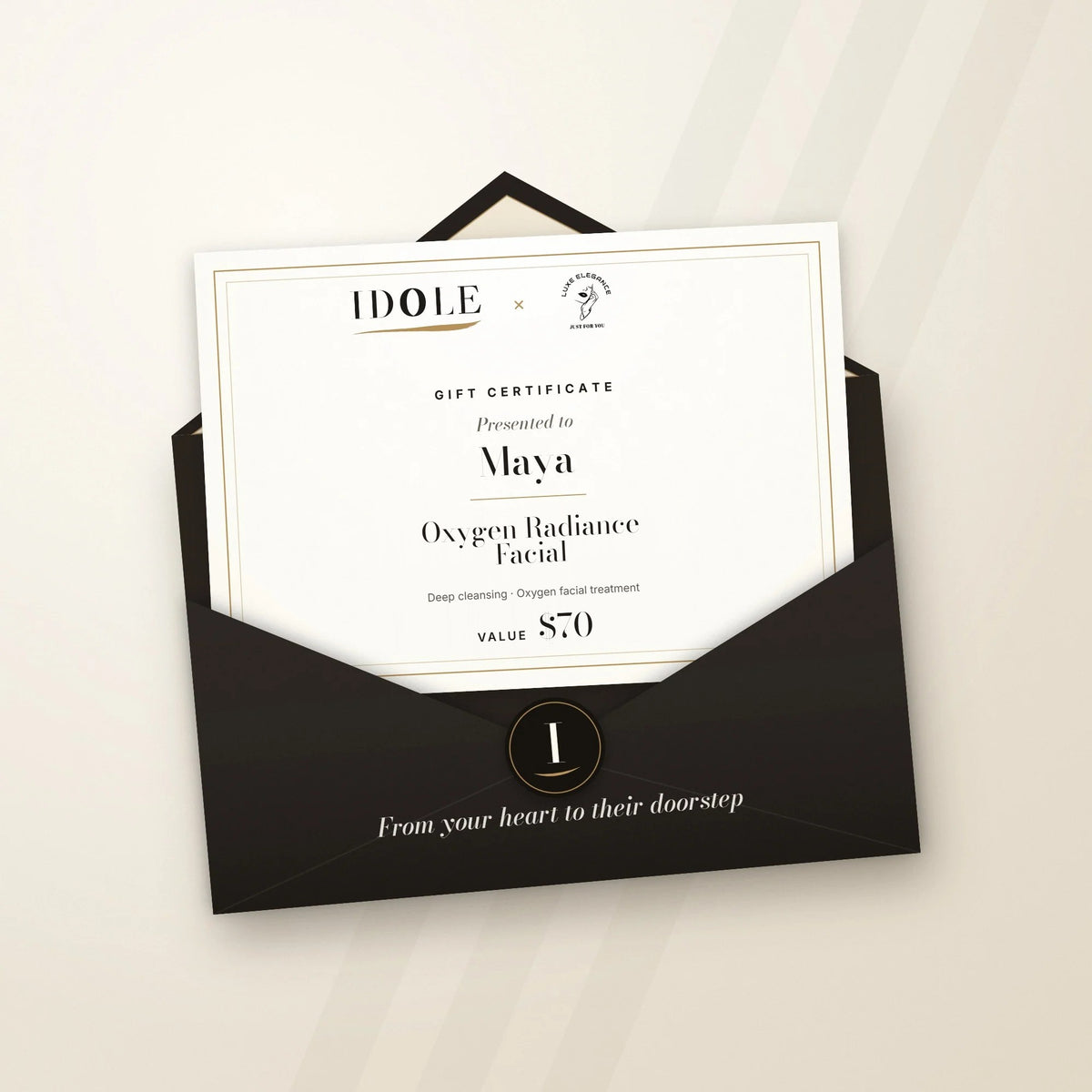 Idole × Luxe Elegance gift certificate for an Oxygen Radiance Facial, $70, in an espresso Idole envelope with monogram seal
