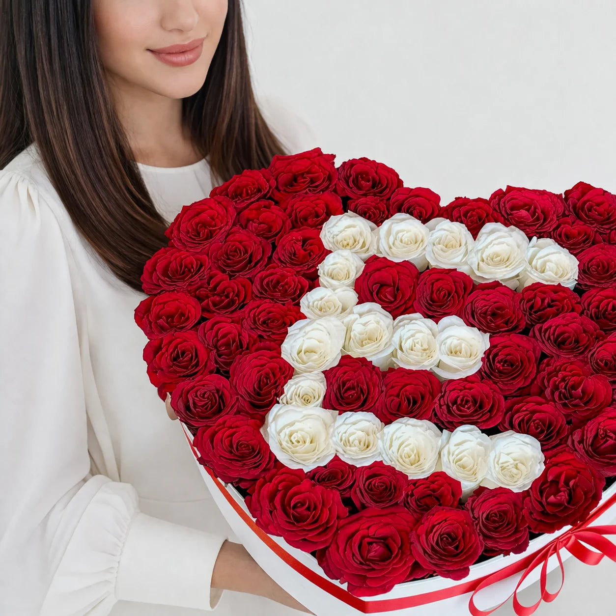 Luxury heart-shaped box arrangement of premium red and white roses by Idole Lebanon